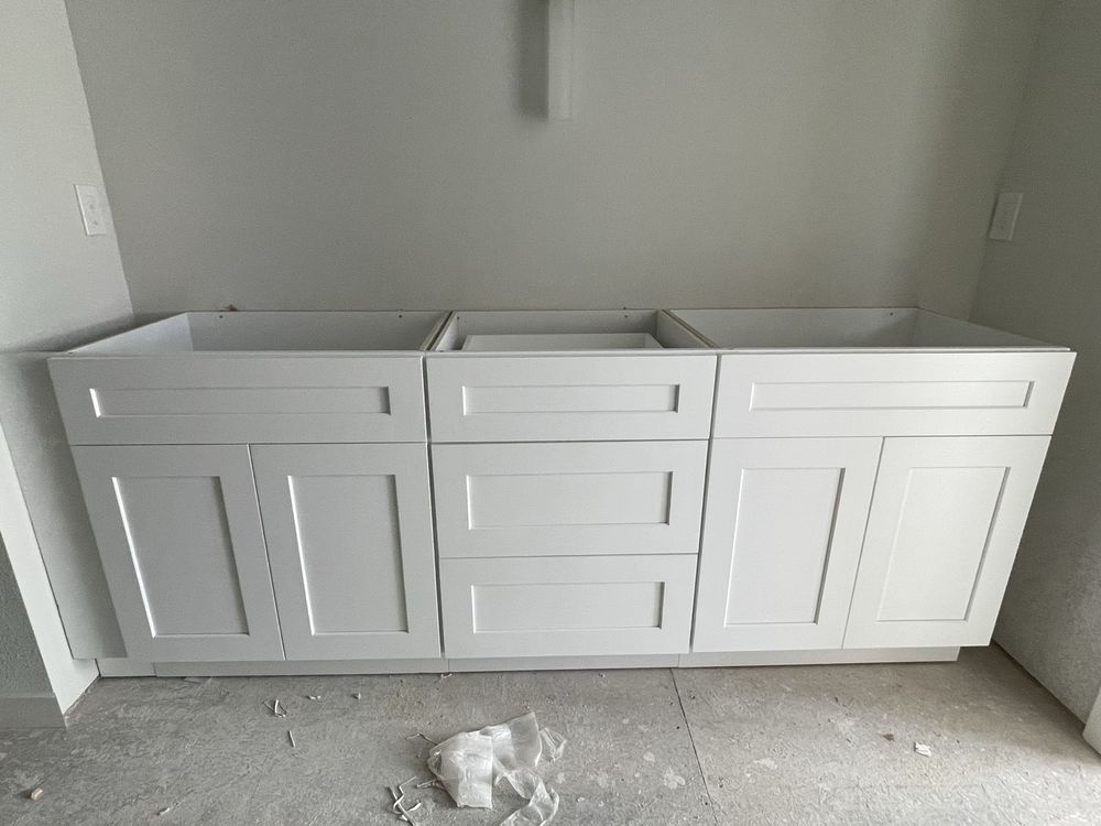 White shaker base cabinet run installed and ready for countertops